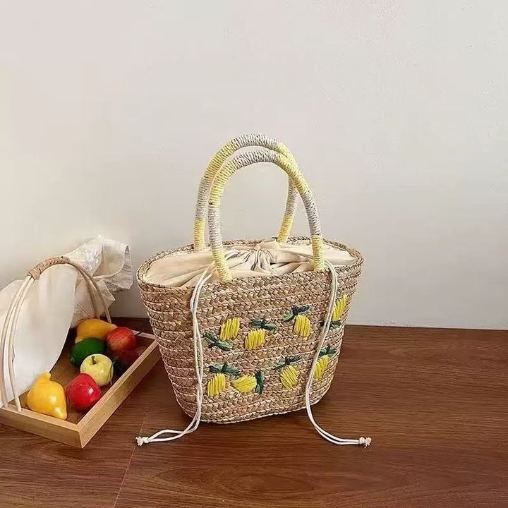 Spacious straw bag with lemon embroidery Bowlift