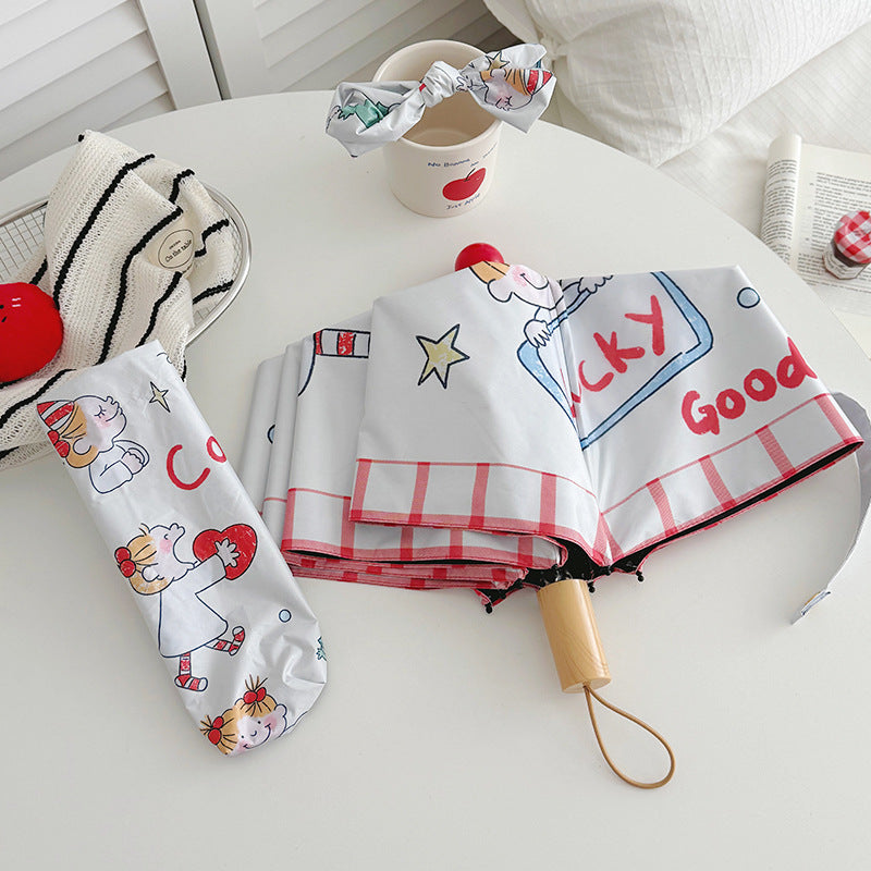 Ladies folding umbrella with playful children's motif Bowlift