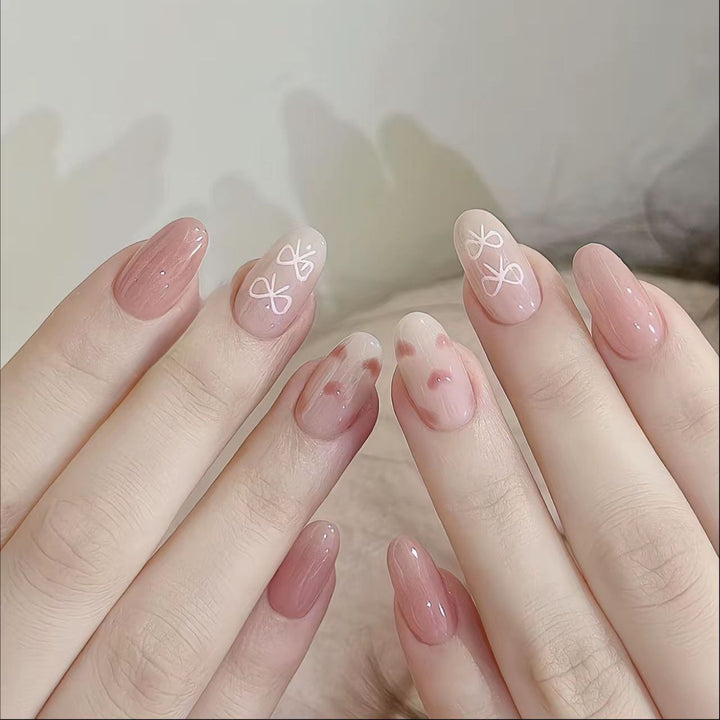 Artistic Heart-Embellished Stiletto Nails