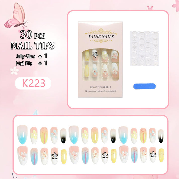 Artificial nail set with floral and glittering decorations Bowlift