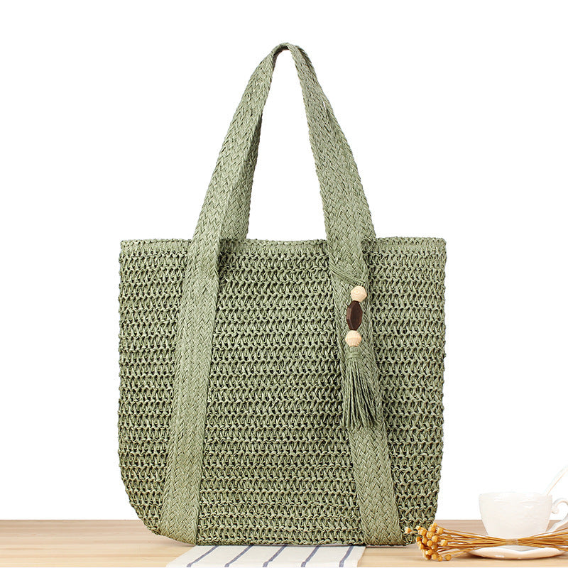 Eco-friendly straw tote bag with elegant tassel detail Bowlift