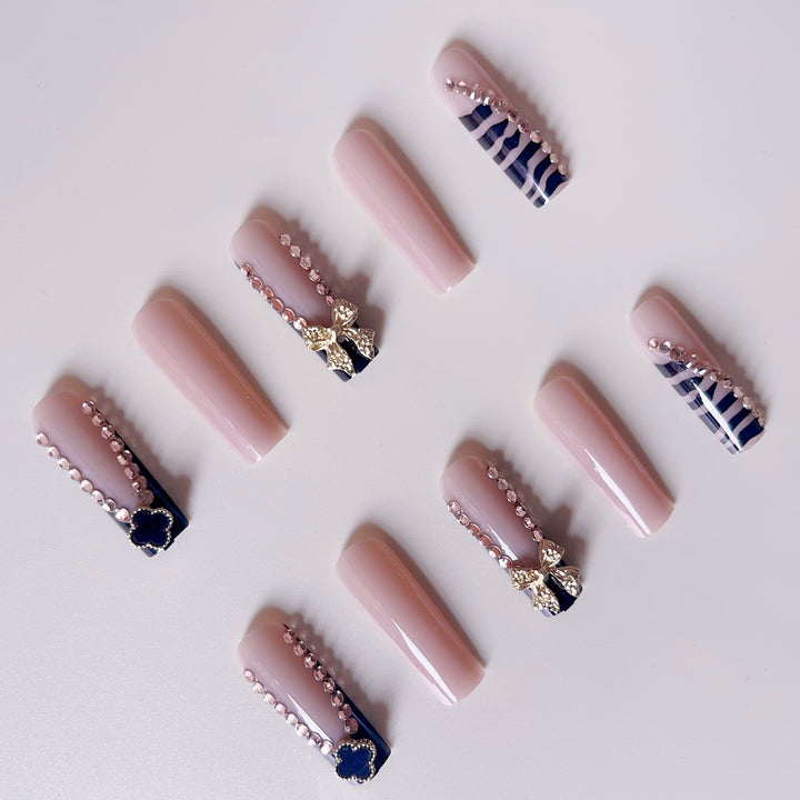Glamorous artificial nails with elegant design with rhinestones and 3D decorations Bowlift