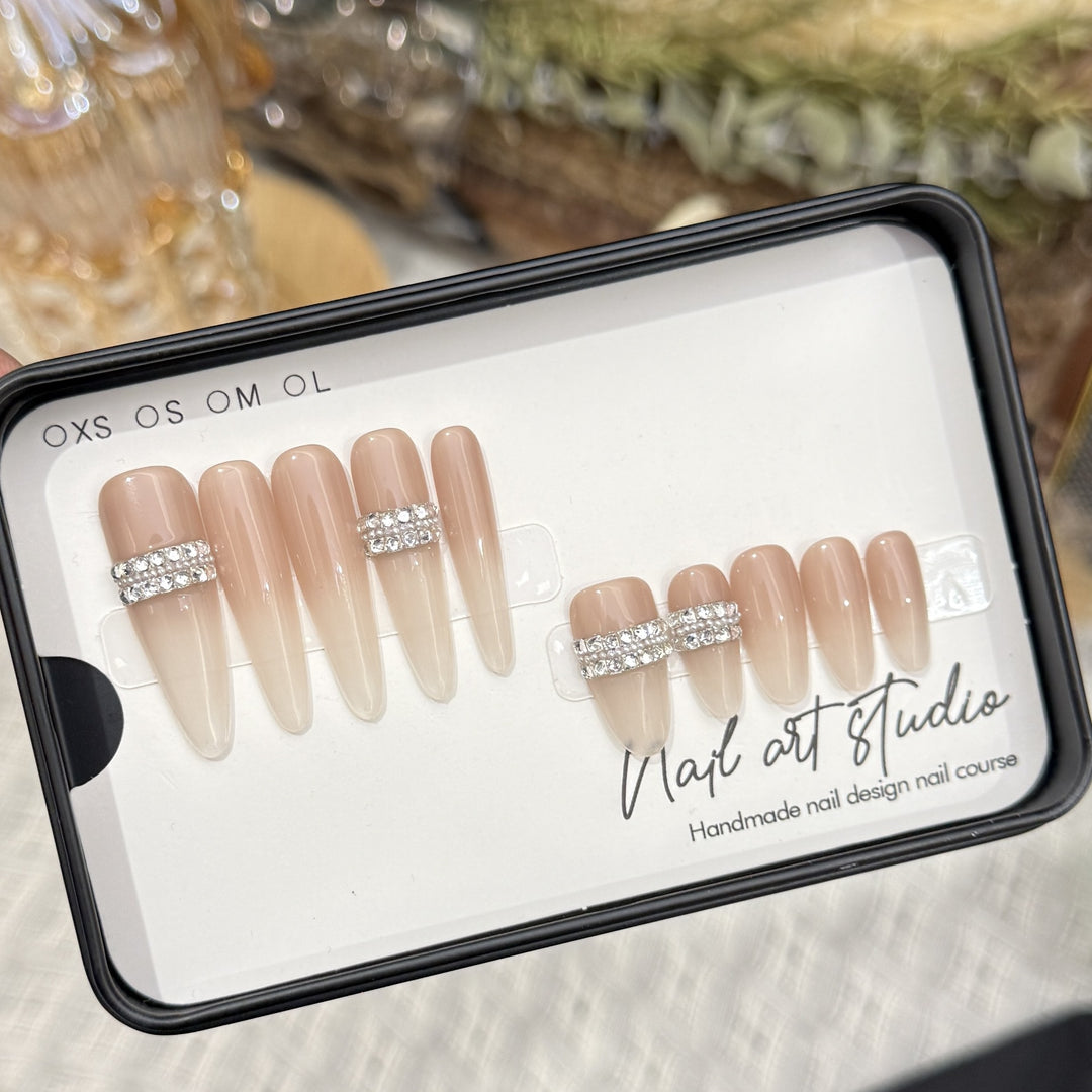 Stiletto Nail Art Tips with Rhinestone Accents Bowlift