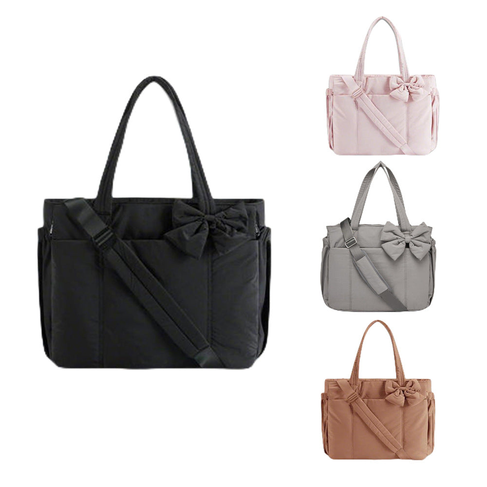 Practical tote bag with retractable shoulder strap and fashionable bow Bowlift