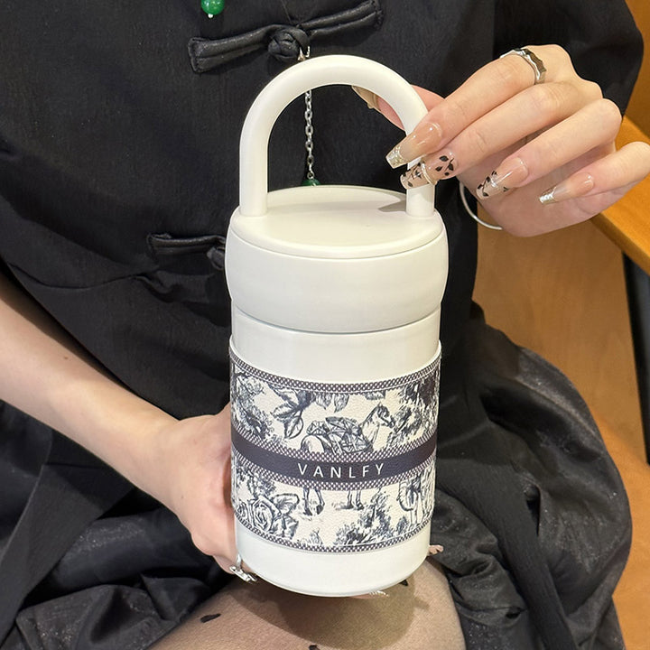 Women's stylish thermos cup with practical carrying handle Bowlift