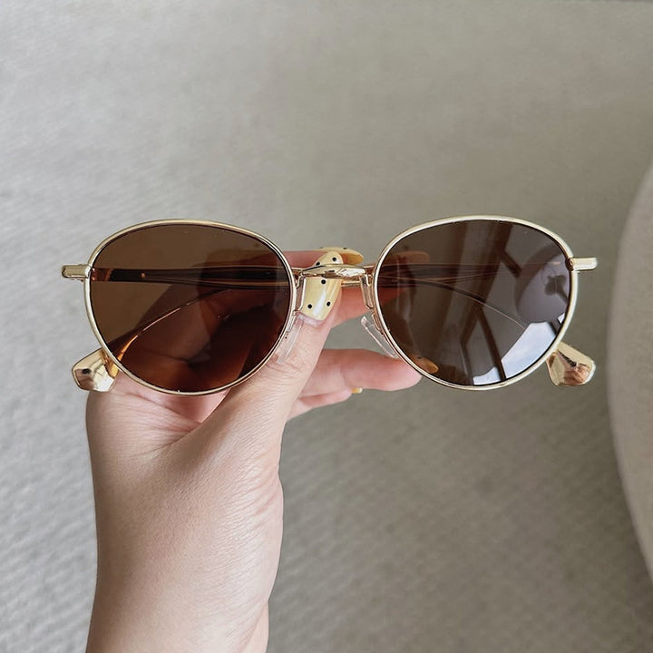Women's round sunglasses with elegant metal frame and UV protection Bowlift