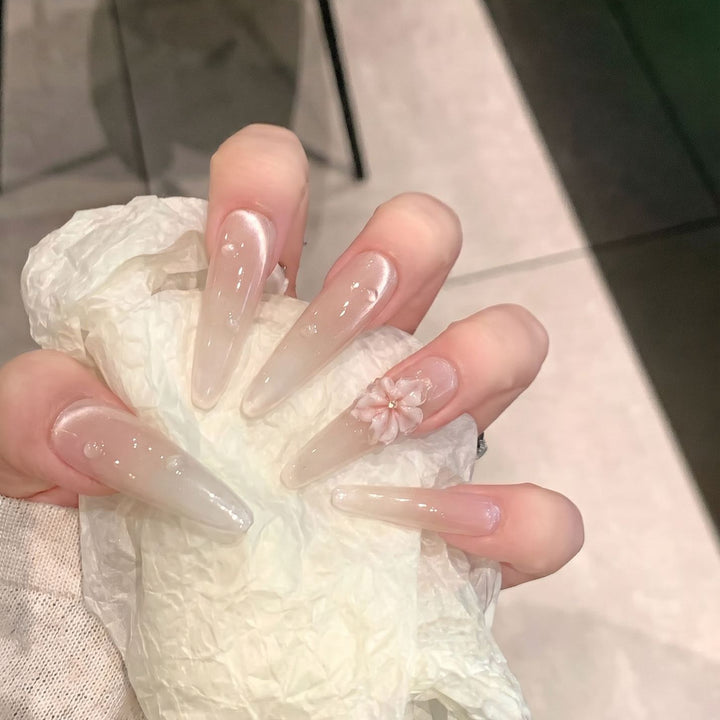 Elegant Stiletto Nail Extensions with Floral Accents Bowlift