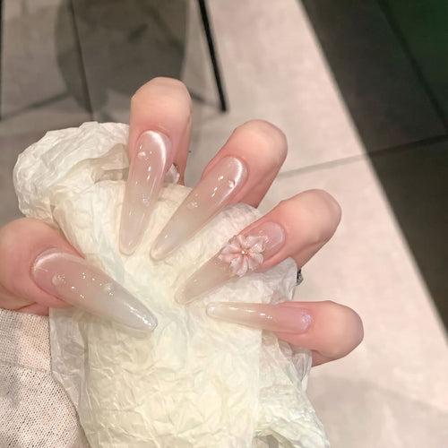 Elegant Stiletto Nail Extensions with Floral Accents Bowlift