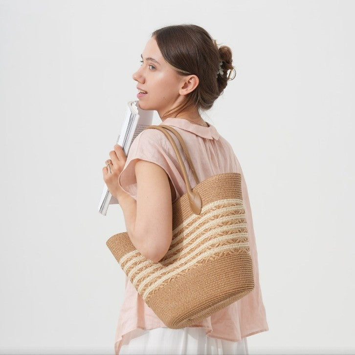Beach bag made of natural woven material with elegant accents Bowlift