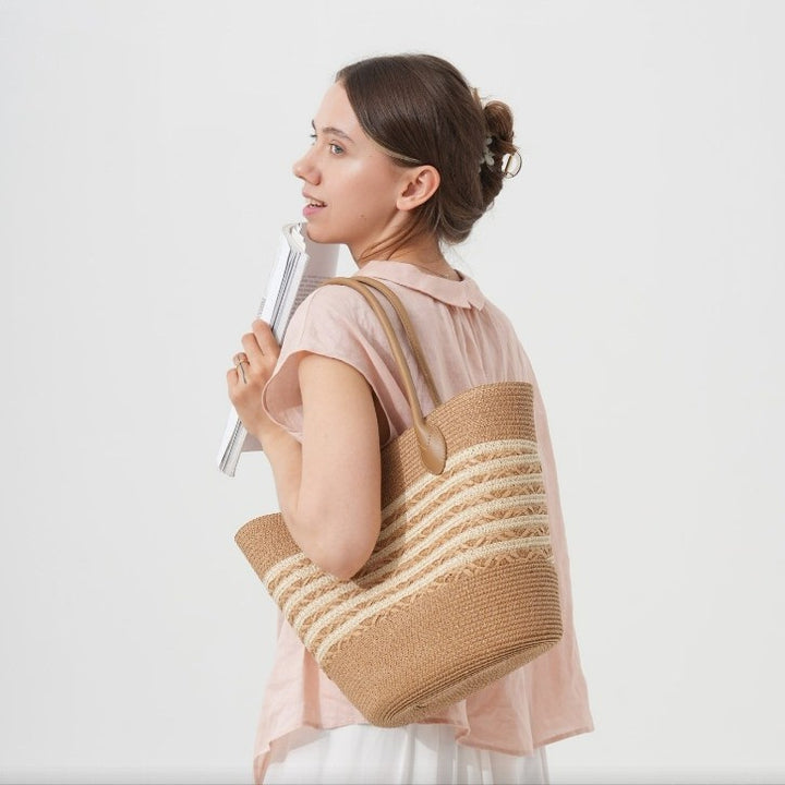 Beach bag made of natural woven material with elegant accents Bowlift
