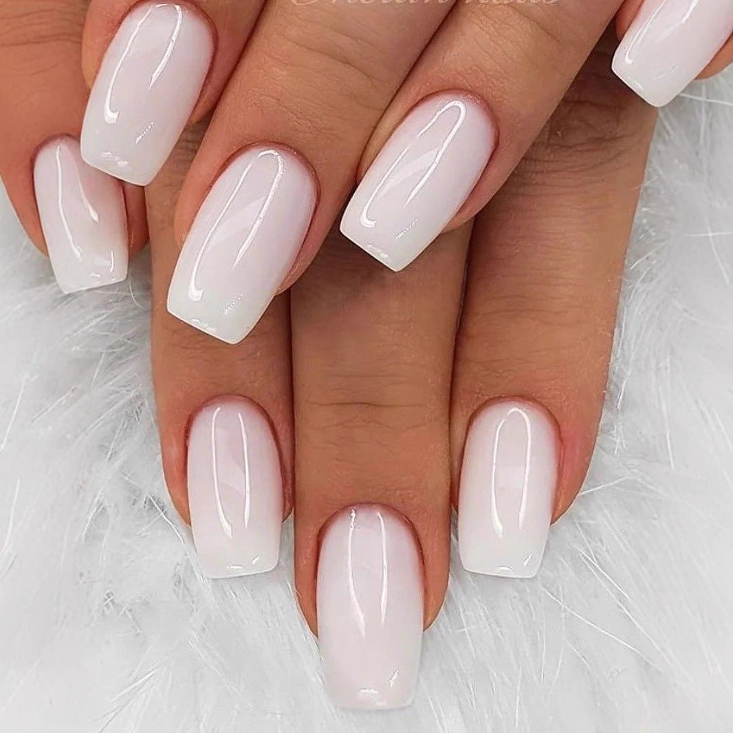 Artificial nails in elegant French design with high-gloss finish Bowlift