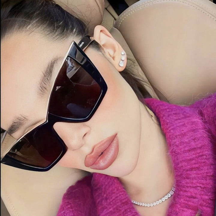 Women extravagant sunglasses with unique design and golden accents Bowlift
