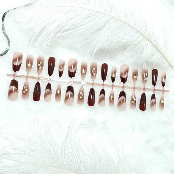 Artificial nails with elegant color gradients and jewelry details Bowlift
