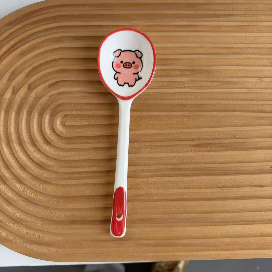 Ceramic soup spoon with lucky cat illustration and ergonomic long-handle Bowlift