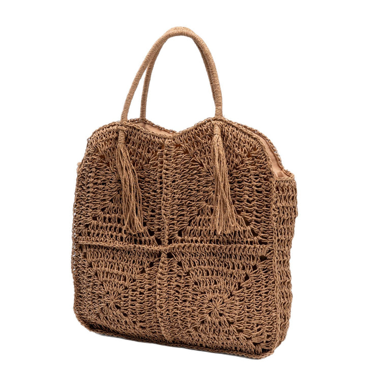 Spacious handbag made of braided natural material with fringes Bowlift