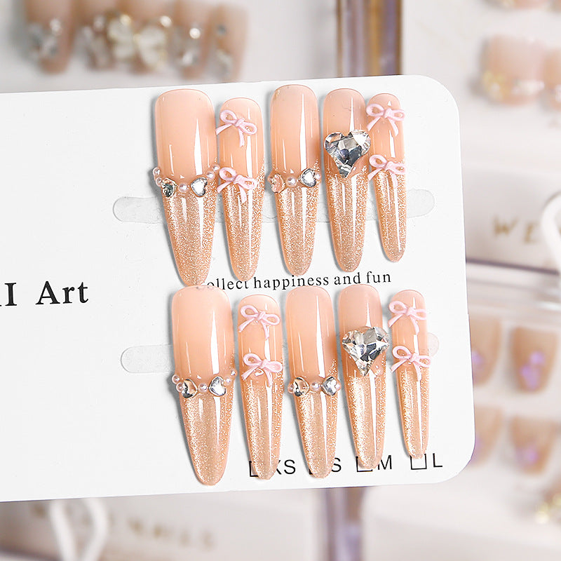 Art nail set with sparkling tips and delicate bow decorations Bowlift