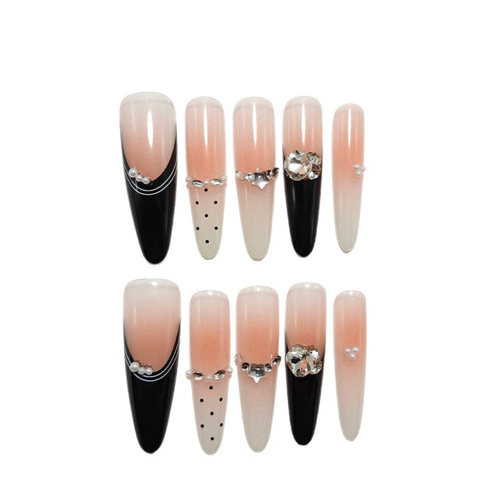 Artificial nails in elegant design with glittering decorations Bowlift