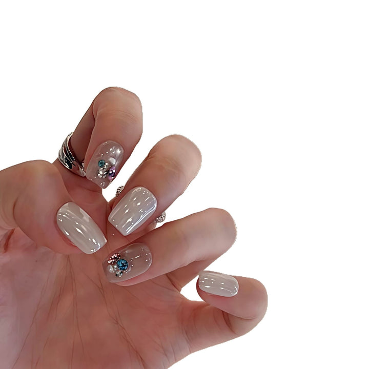 Artificial nails with elegant jewelry accents Bowlift