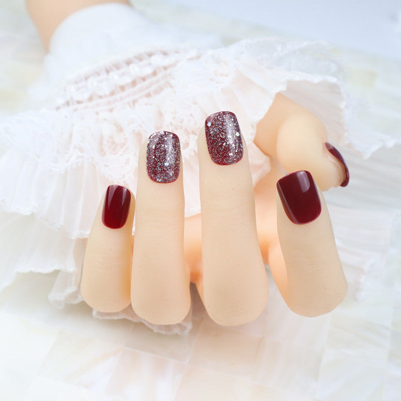 Glossy Press-On Nail Set with Glitter Accents Bowlift