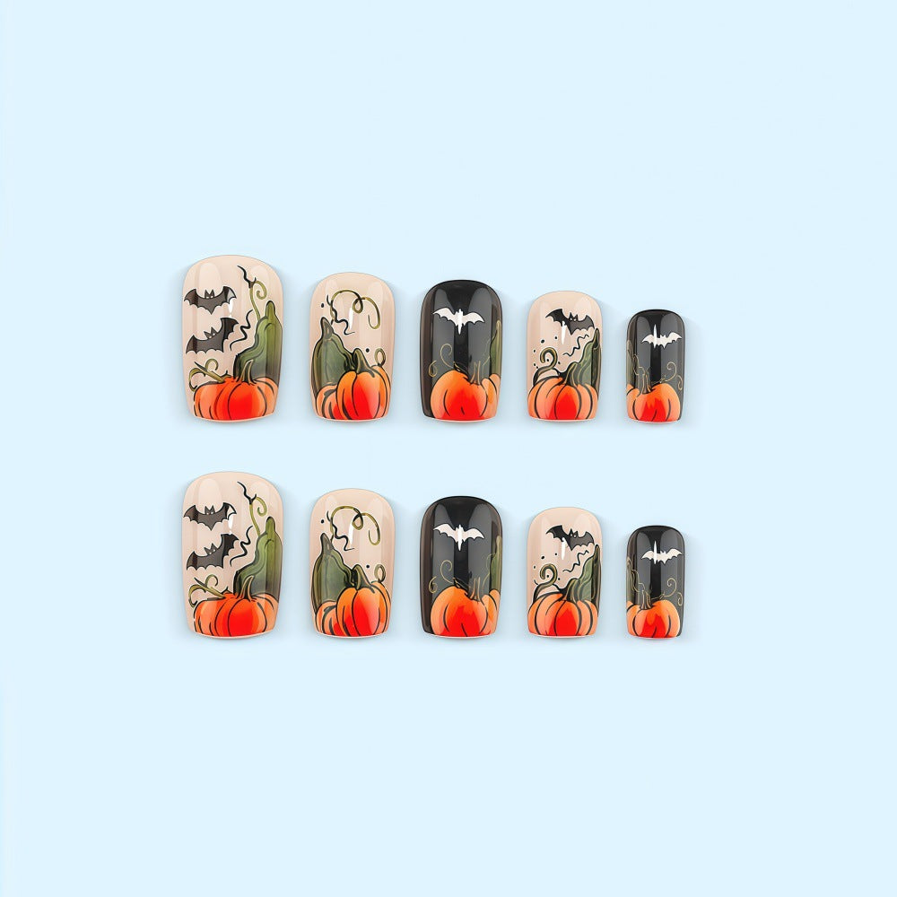Artificial nails in Halloween design with pumpkins and ghosts Bowlift