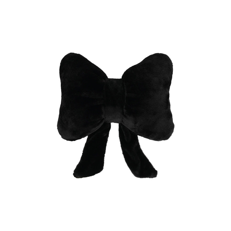 plush bow-shaped decorative throw cushion with long tails and faux-fur texture Bowlift