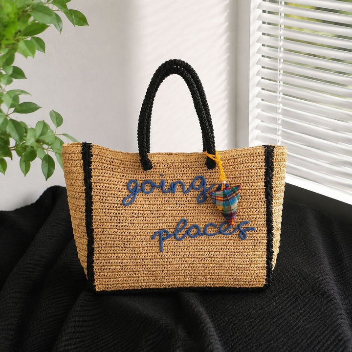 Leisure bag made of woven natural material with colorful pendant Bowlift