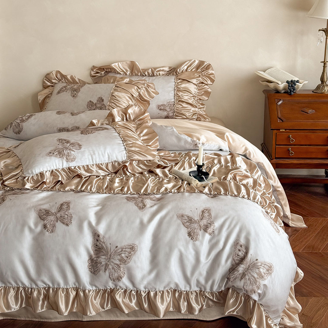 Luxurious satin bedding set with lush ruffles and butterfly print