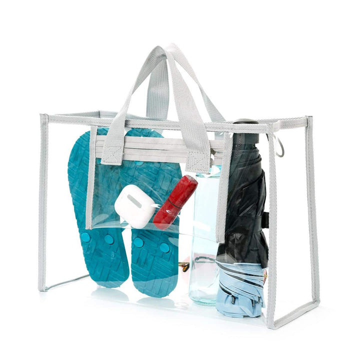 Transparent beach bag with sturdy carrying handles and various compartments Bowlift