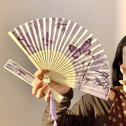 Elegant fan with elaborate butterfly motif Bowlift
