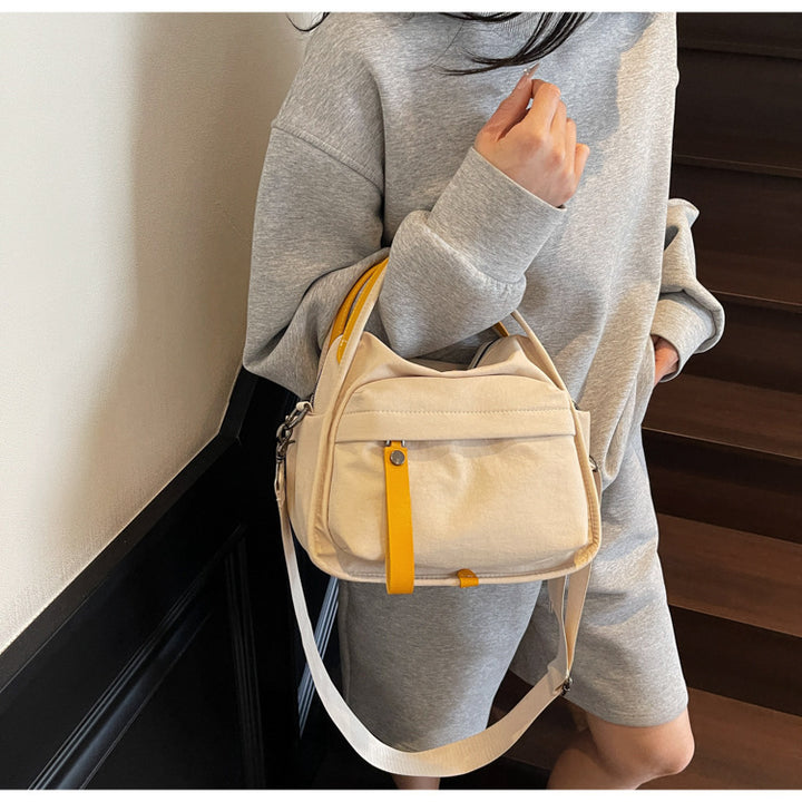 Fashionable shoulder bag with innovative structure and detachable carrying strap Bowlift