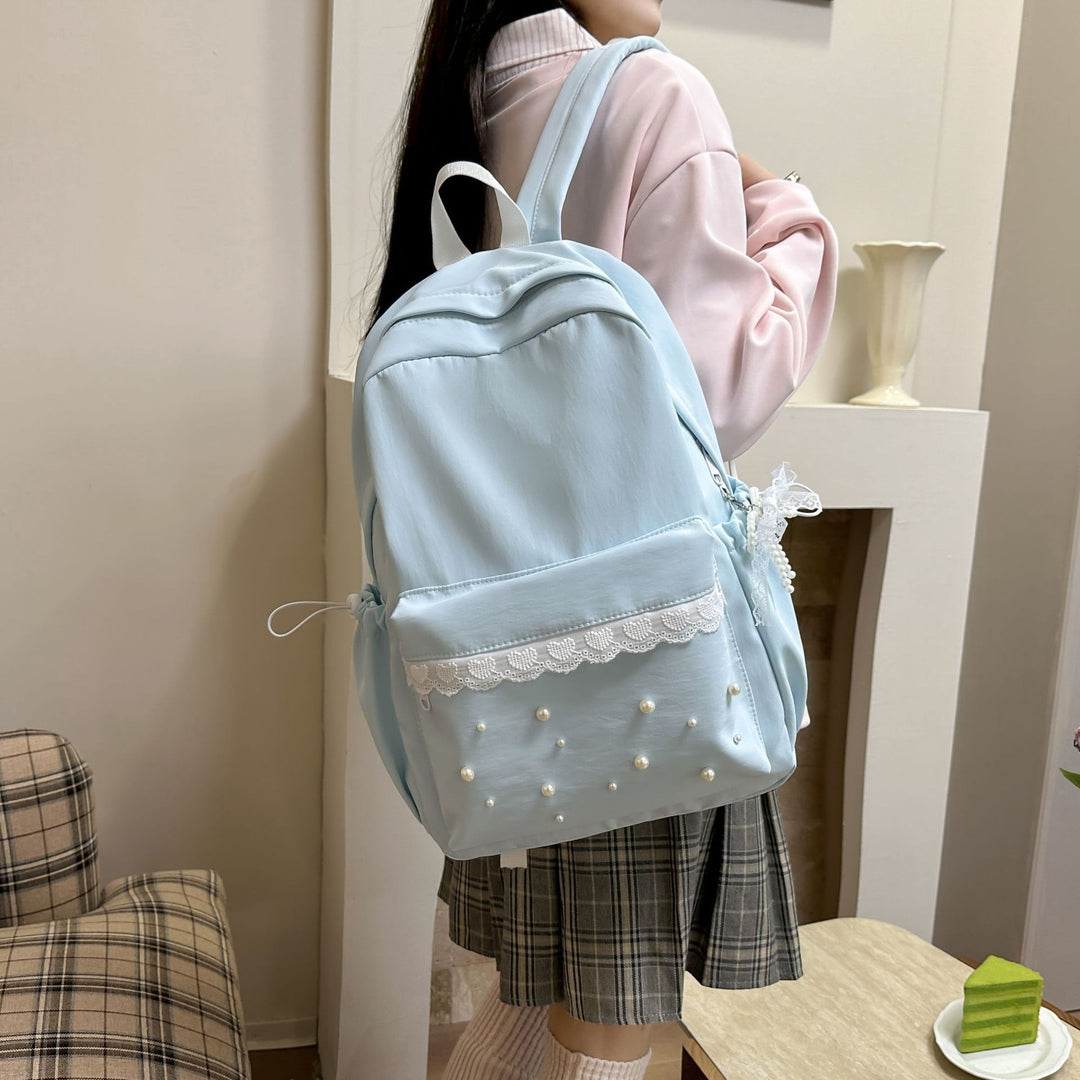 Backpack with elegant pearl applications and intricate design Bowlift