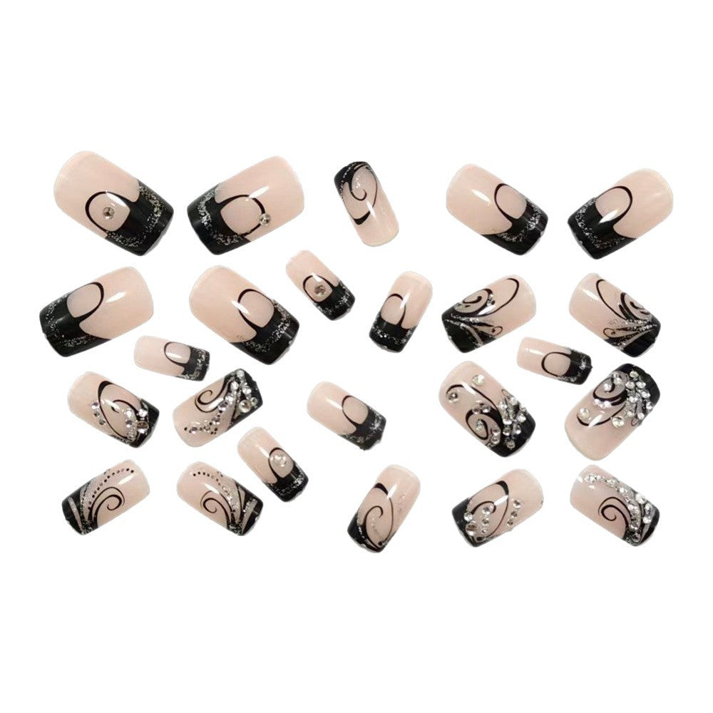Artificial nails in elegant black-and-white design with glitter applications Bowlift
