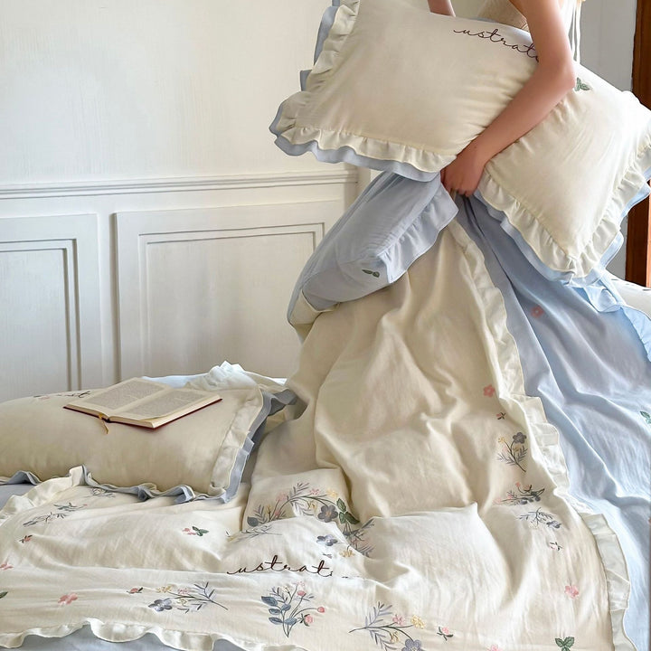 Cotton bedding set in country house style with ruffle edge and fine floral embroidery Bowlift