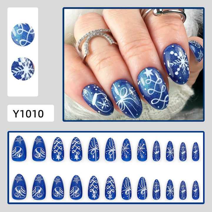 Artificial nails in festive winter design with glittering snowflakes and elegant decorations Bowlift
