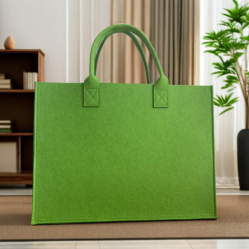Structured felt tote bag with reinforced handles and organized interior Bowlift