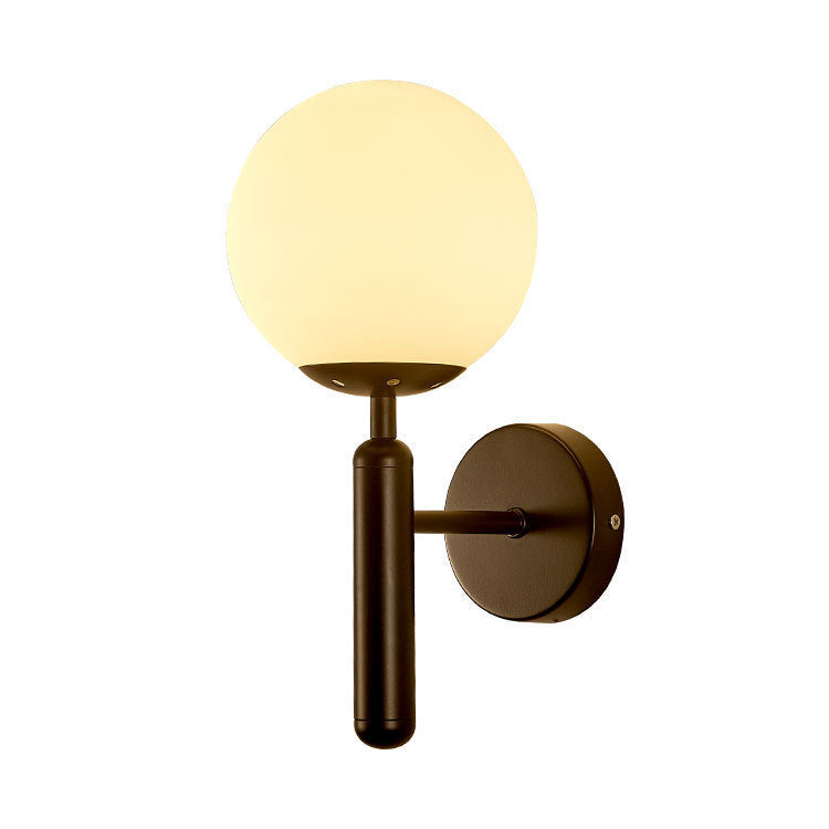 Modern wall sconce with opal glass globe and minimalist vertical stem Bowlift