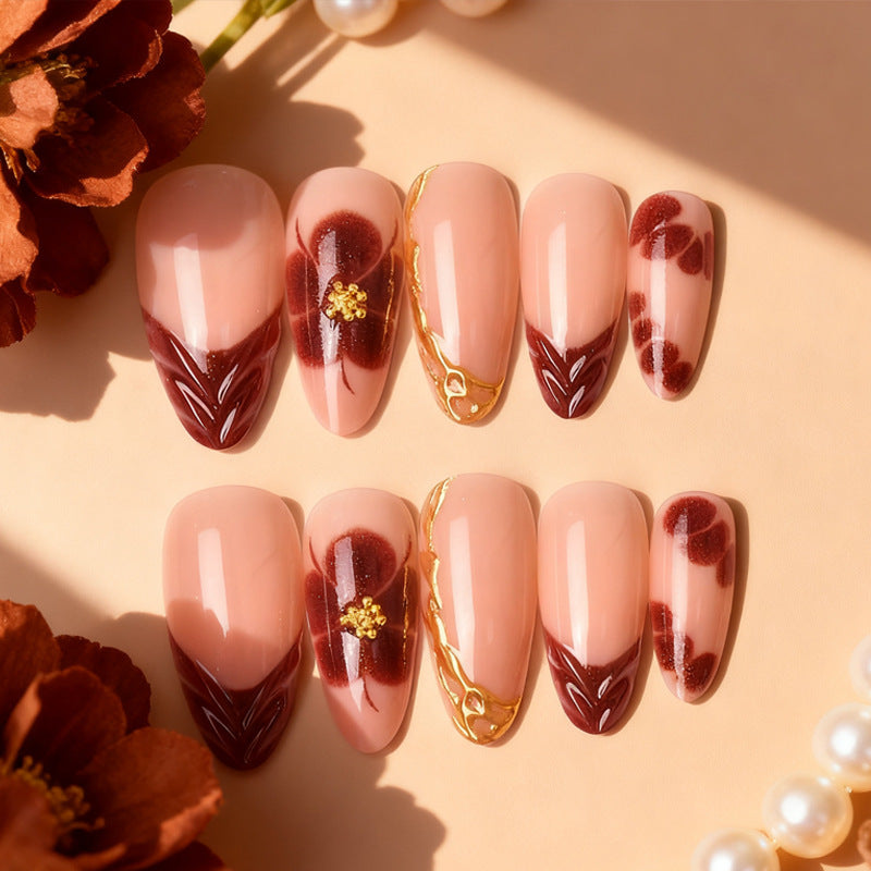 Exclusive artificial nails with floral designs and gold embellishments Bowlift