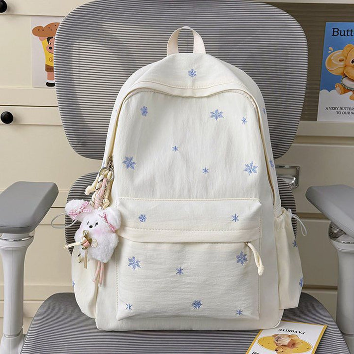 Playful backpack with fine embroidery Bowlift