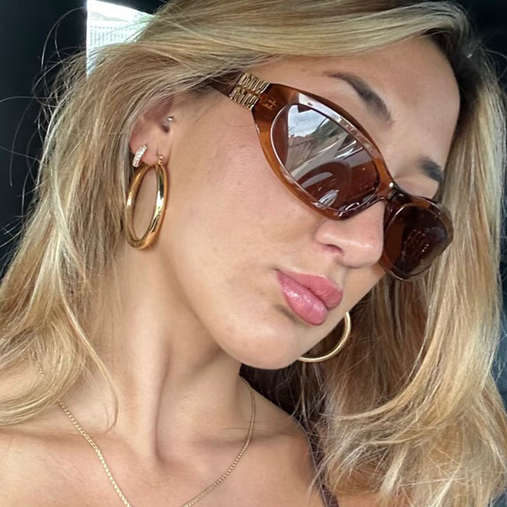 Women’s fashionable sunglasses in a curved design with luxurious details Bowlift