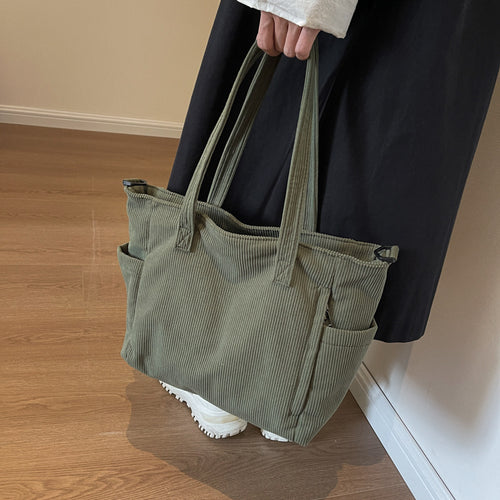 Textured Multi-Pocket Travel Tote Bowlift