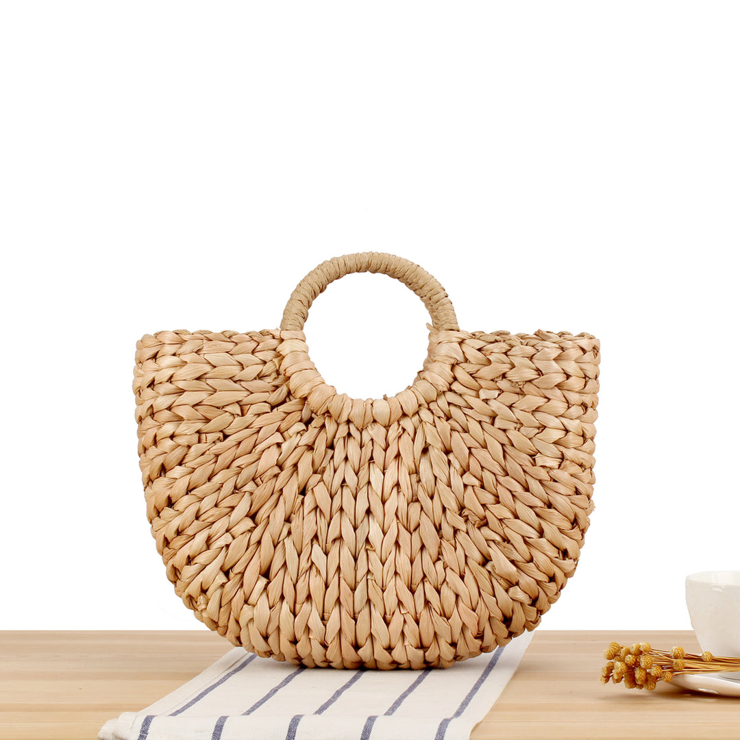 Tote bag made of handmade natural material with elegant round handle Bowlift