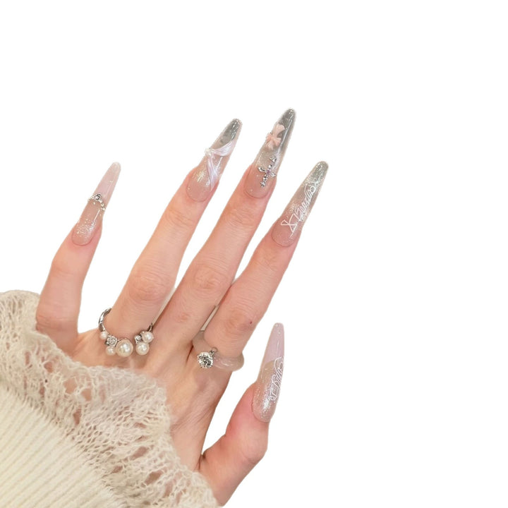 Elegant Stiletto Press-On Nail Set with Intricate Designs Bowlift