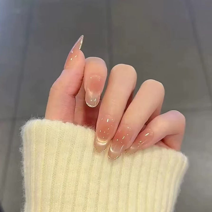 Artificial nails with elegant gloss and glitter accents Bowlift