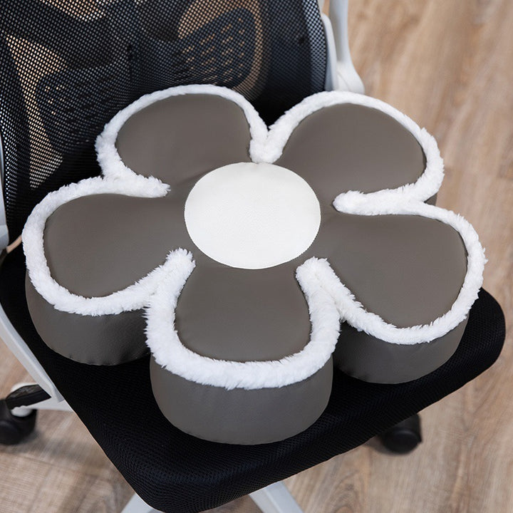 Padded seat cushion in flower shape with faux leather center piece and fluffy edge padding