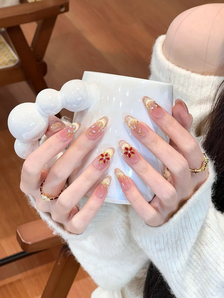 Artificial nails with elegant flower design and glitter accents Bowlift