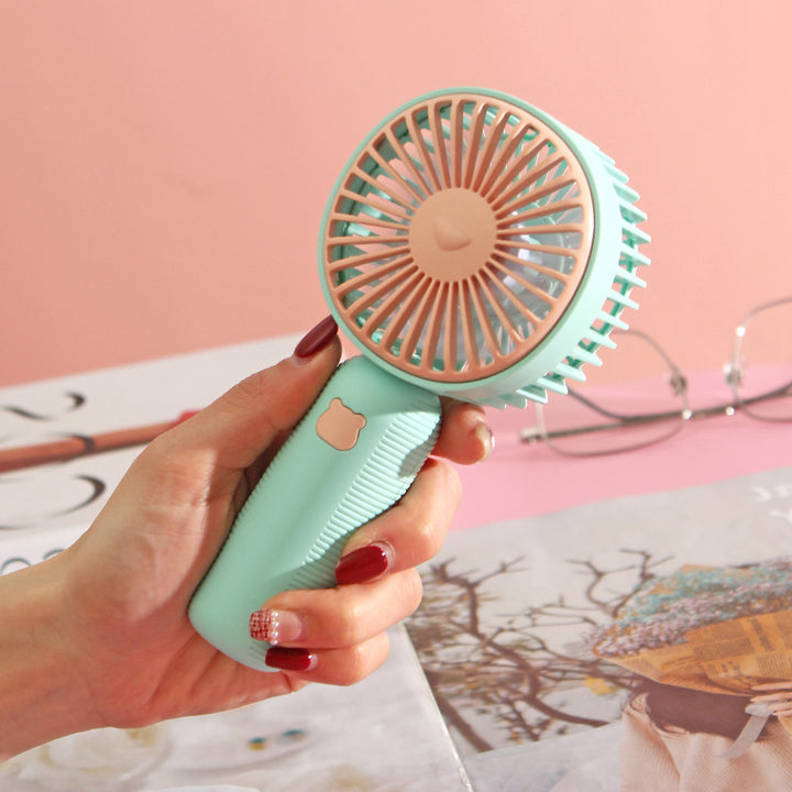 Ladies compact handheld fan with ergonomic grip, quiet brushless motor, and removable stand Bowlift