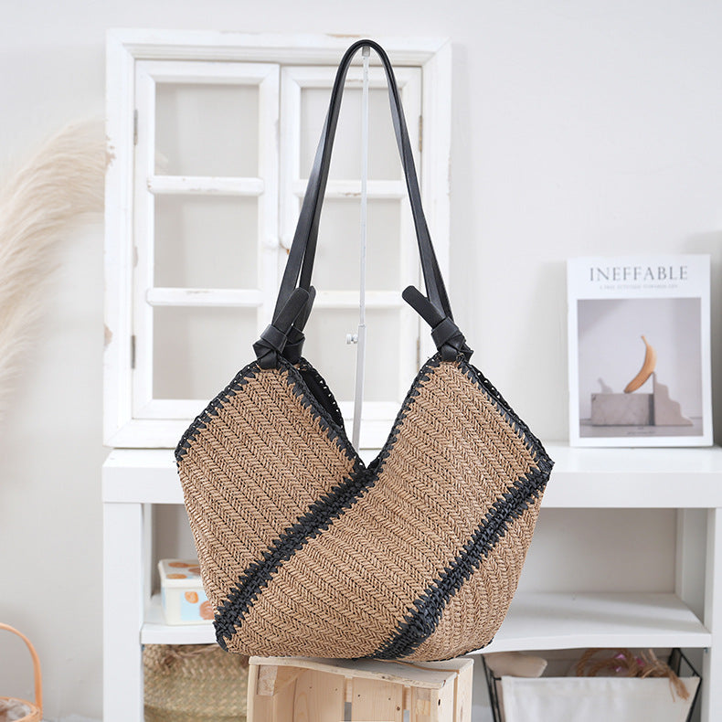 Handbag made of braided natural material with contrasting leather handles Bowlift