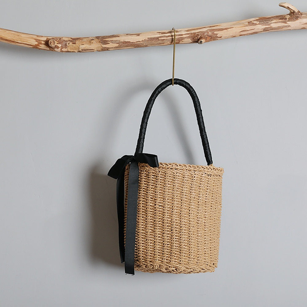 Handwoven basket bag with decorative fabric ribbon Bowlift