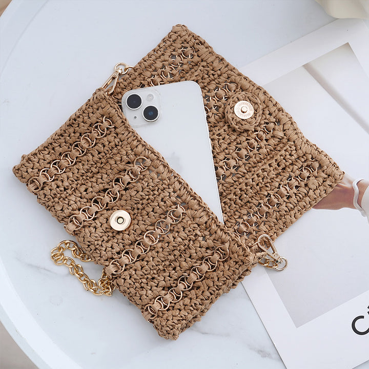 Clutch with chain shoulder strap and handcrafted macrame closure Bowlift