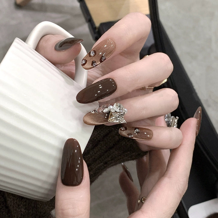 Luxury artificial nails with elegant rhinestone applications Bowlift